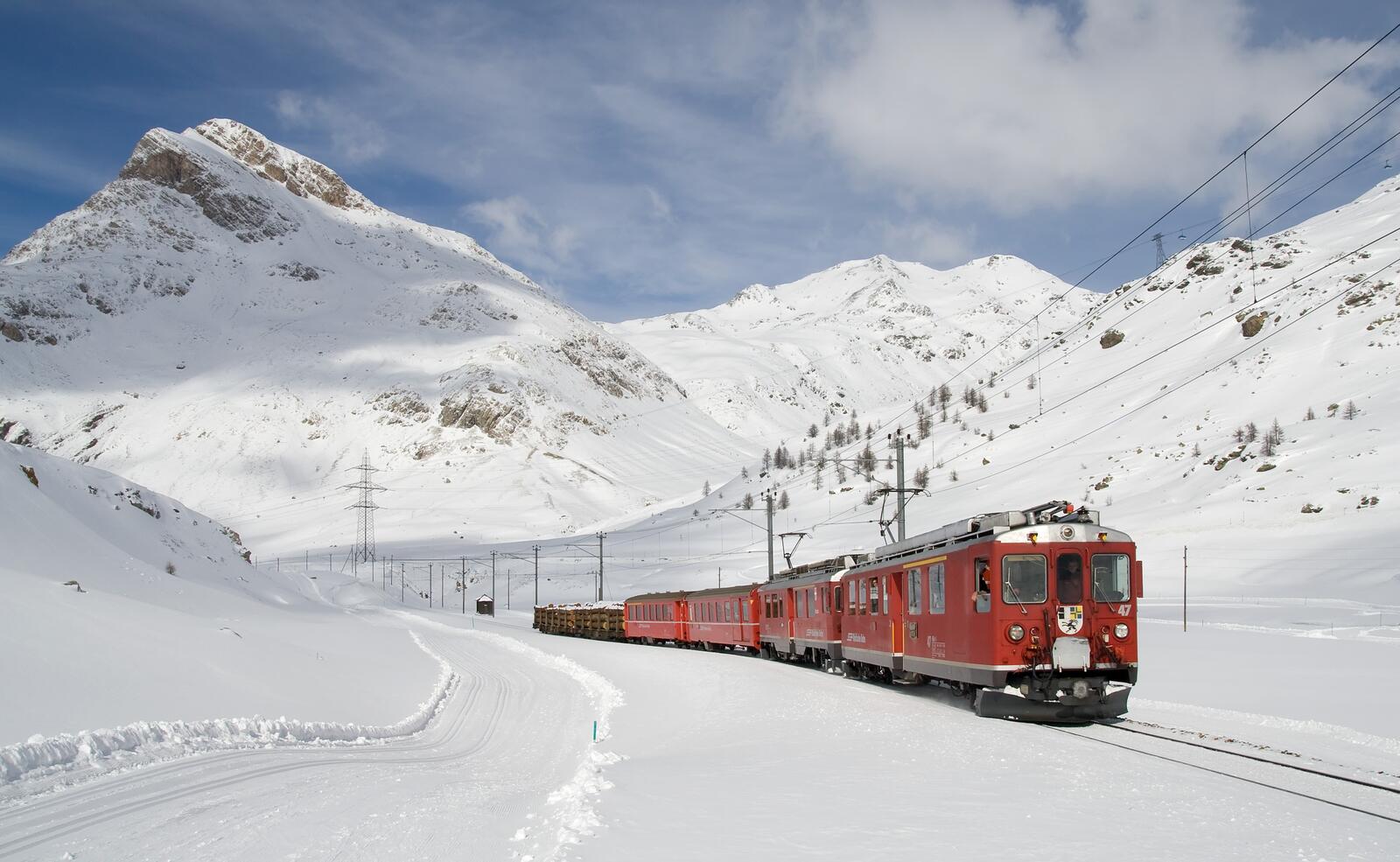 Free photo A train in the snowy mountains