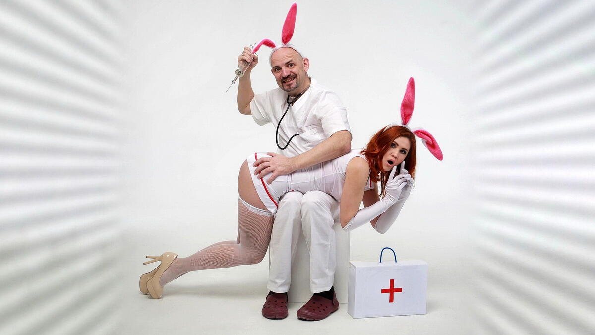 Cosplay doctor and nurse on a light background