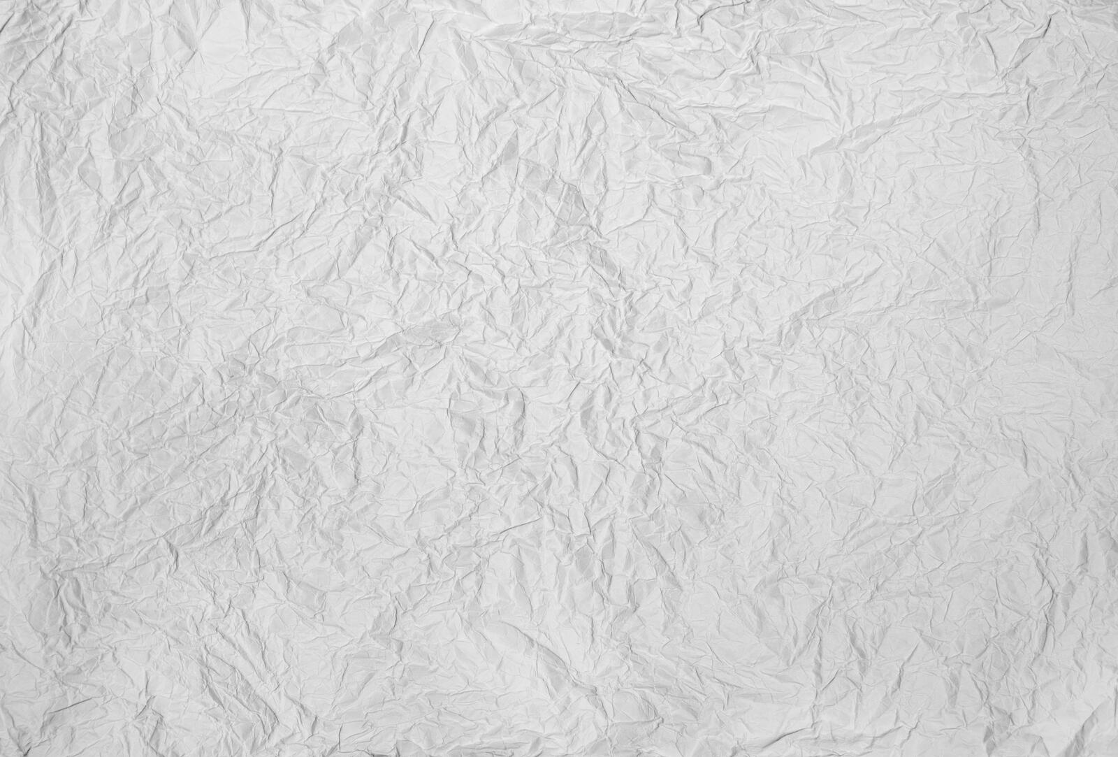Free photo Background of white crumpled paper