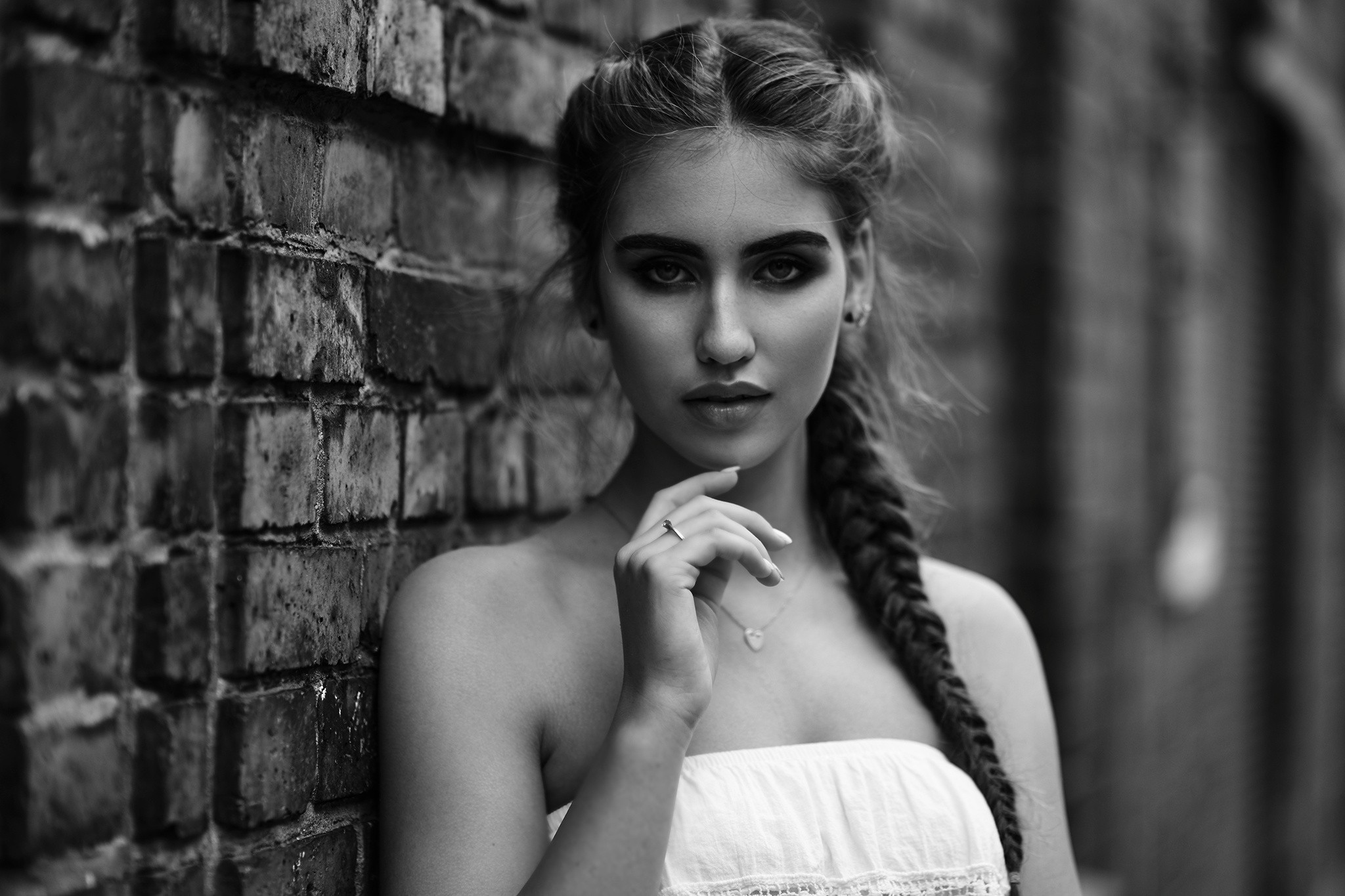 Beautiful girl with bare shoulders in monochrome photo