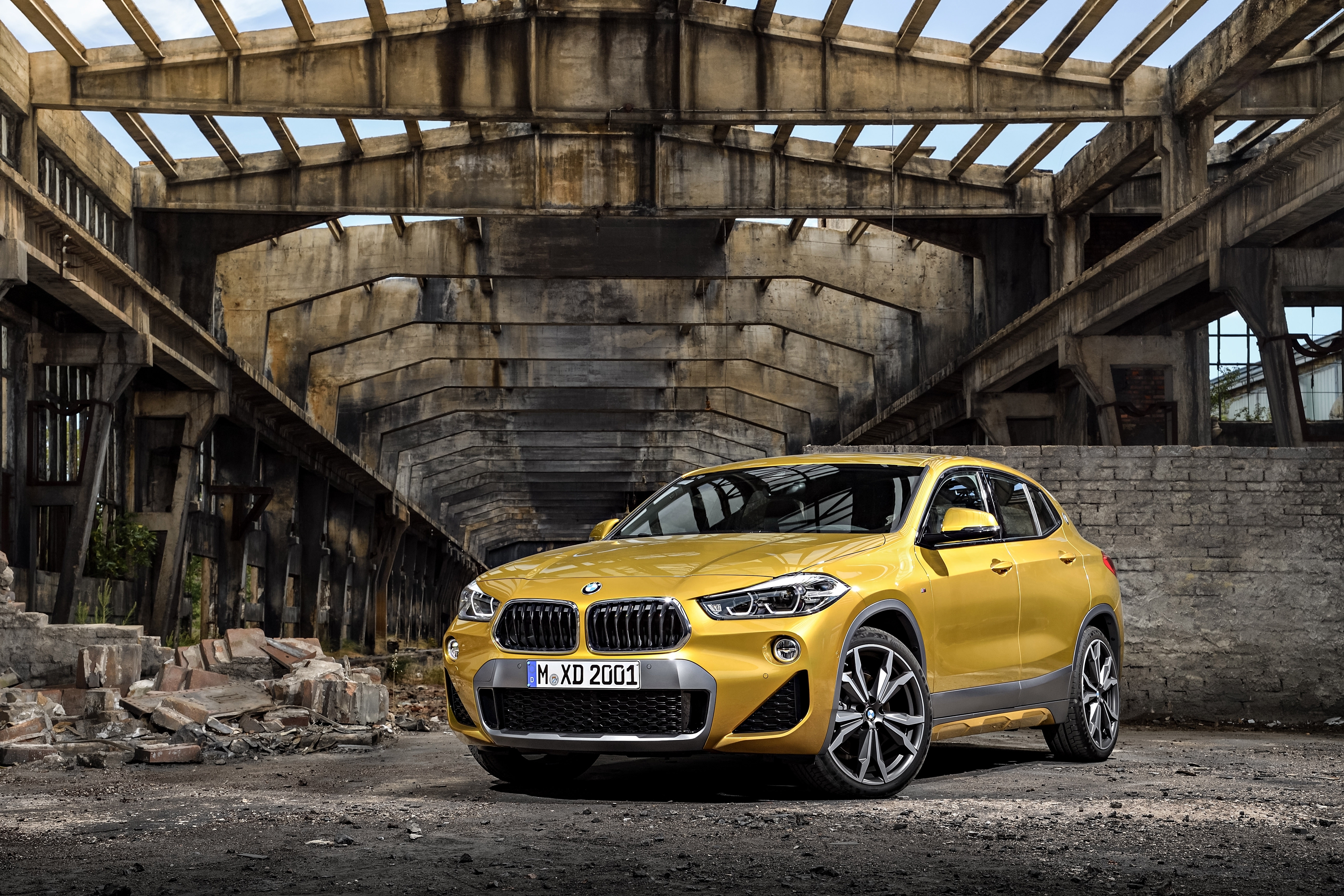 Free photo A gold-colored Bmw x2