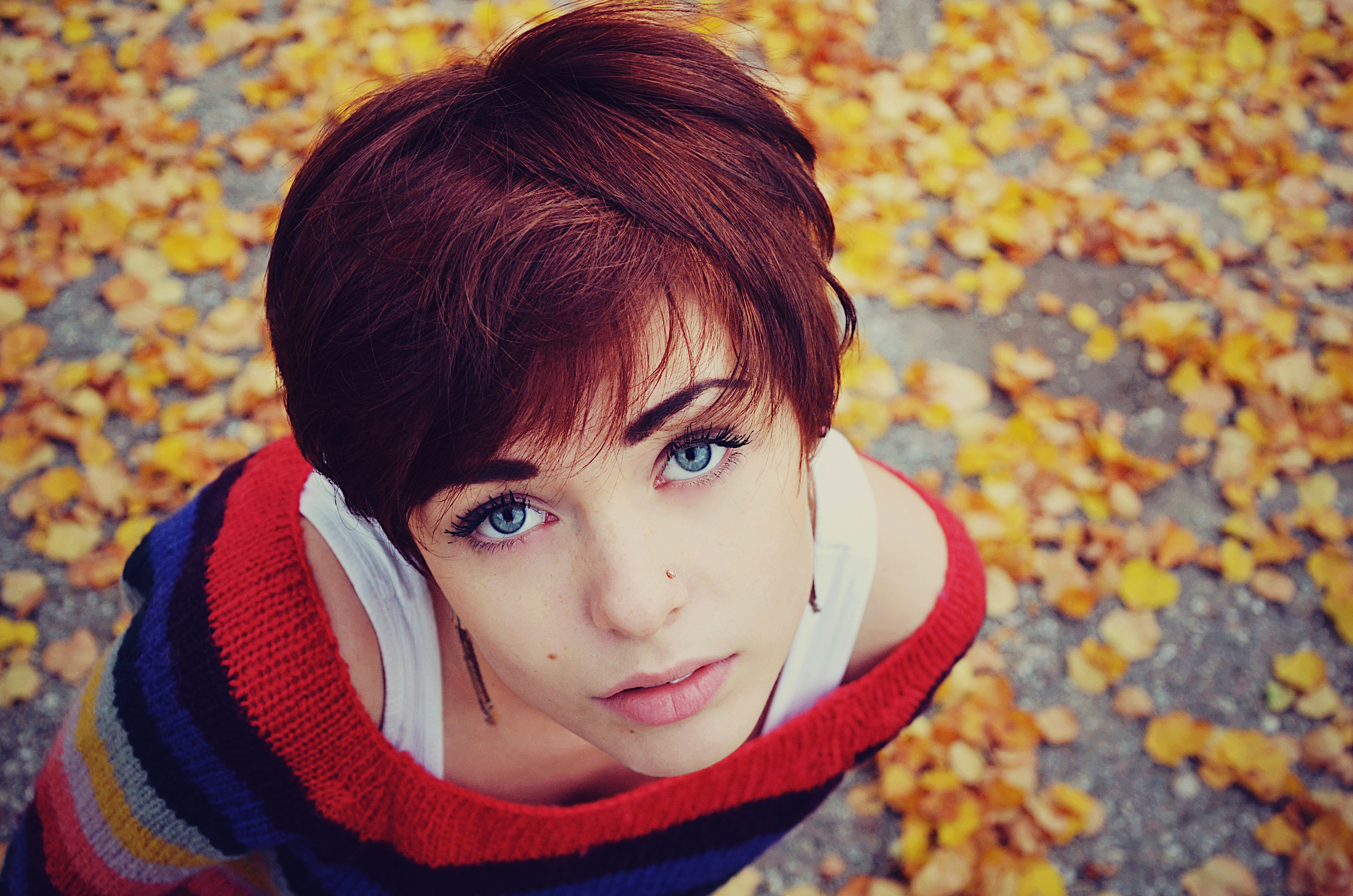 A girl with short hair looks at the camera