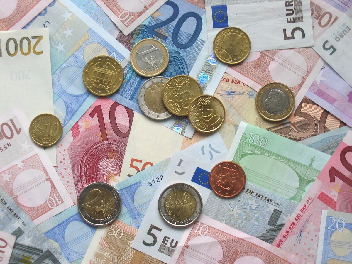 Euro banknotes and coins in various denominations
