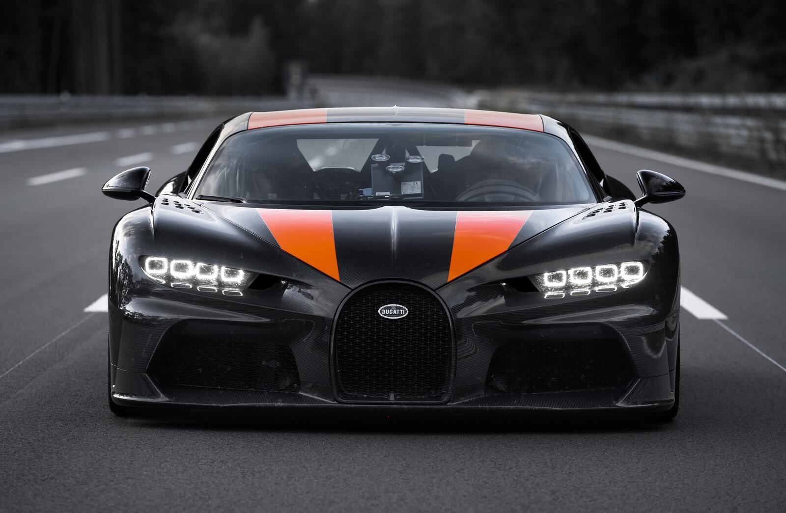 Free photo Black Bugatti Chiron with orange stripes on the hood
