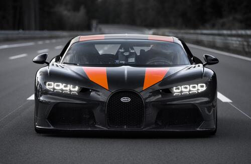 Black Bugatti Chiron with orange stripes on the hood