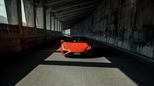 Orange Lamborghini Huracan Evo Spyder 2021 in the tunnel