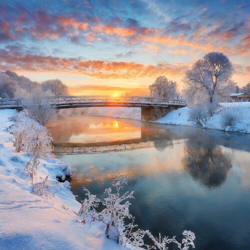 Dawn over the river in winter