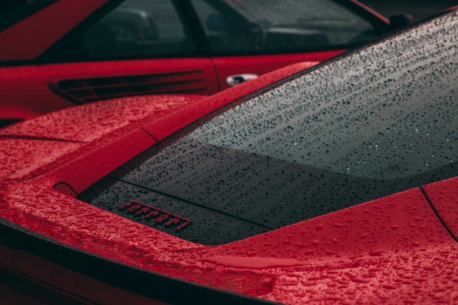 Free photo The Ferrari is standing in the rain