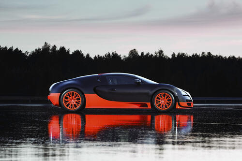 Bugatti Veyron reflected in a puddle.