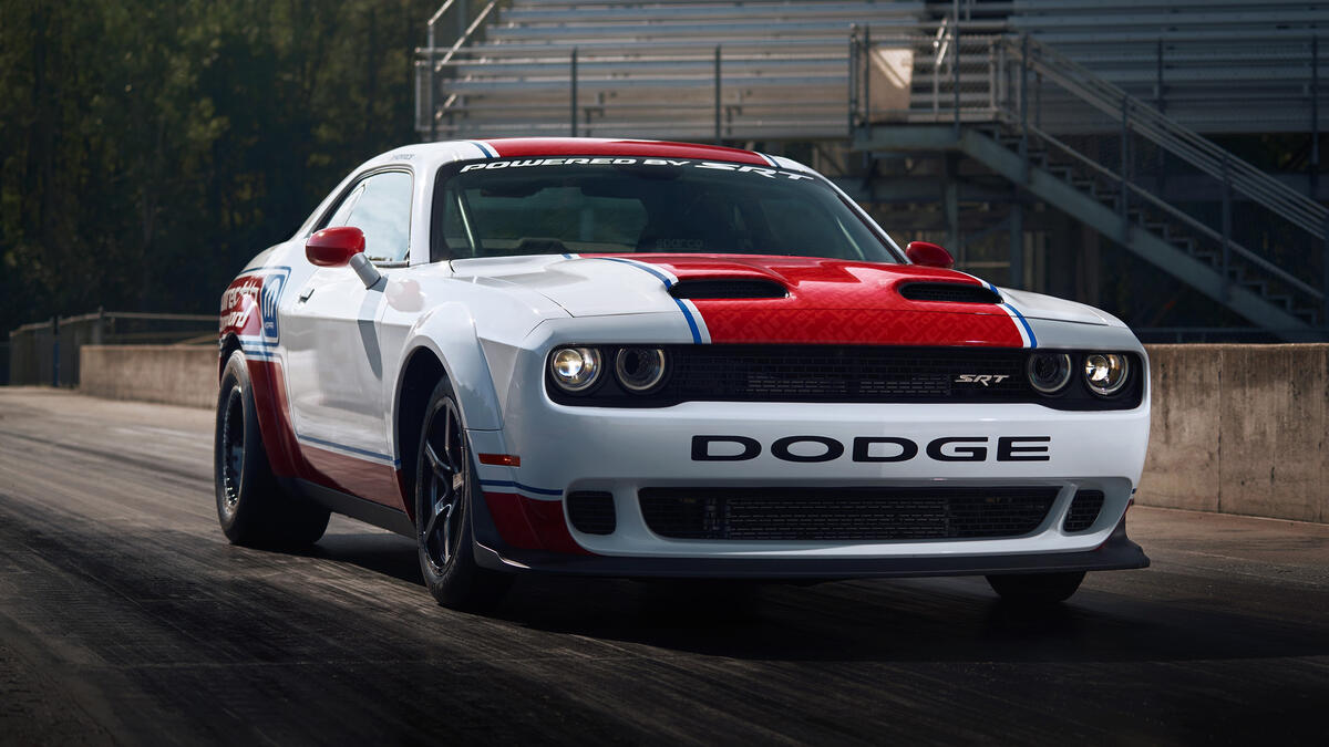 Dodge Challenger with a red stripe on the hood.