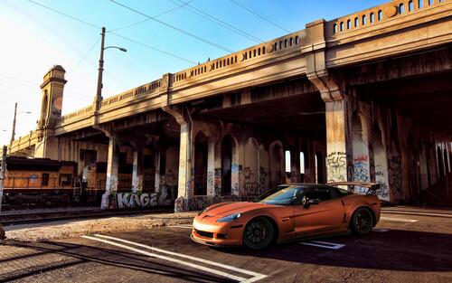 The Corvette is under the bridge