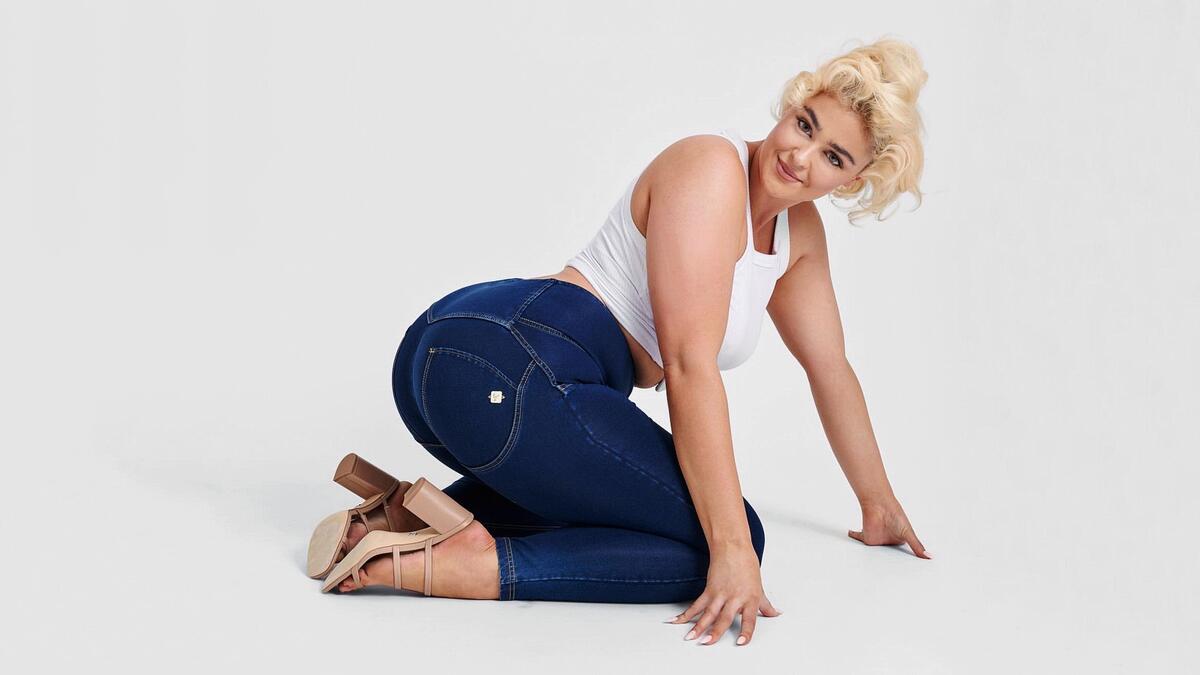Stefania Ferrario in jeans on a light background