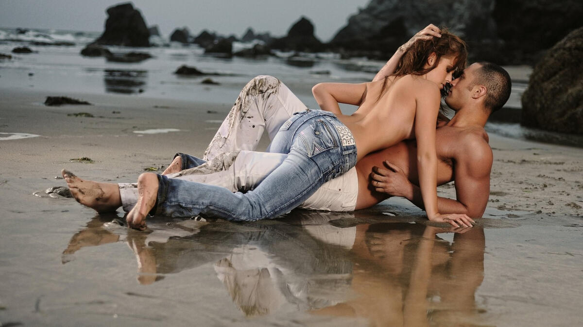 Young couple kissing on the beach