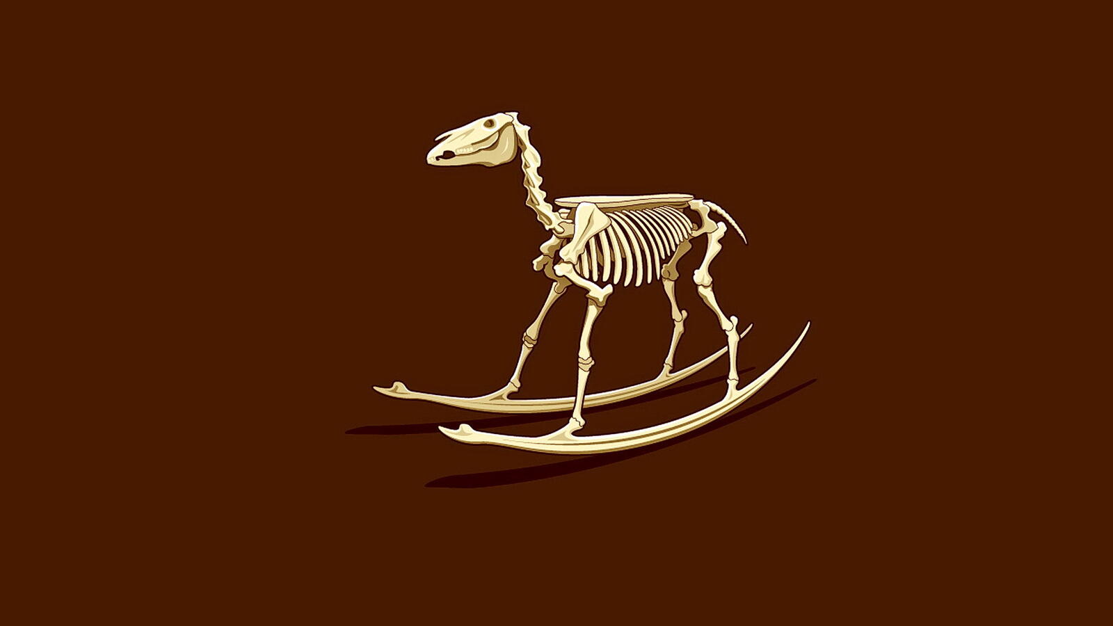 Free photo Children`s rocking horse skeleton on brown background
