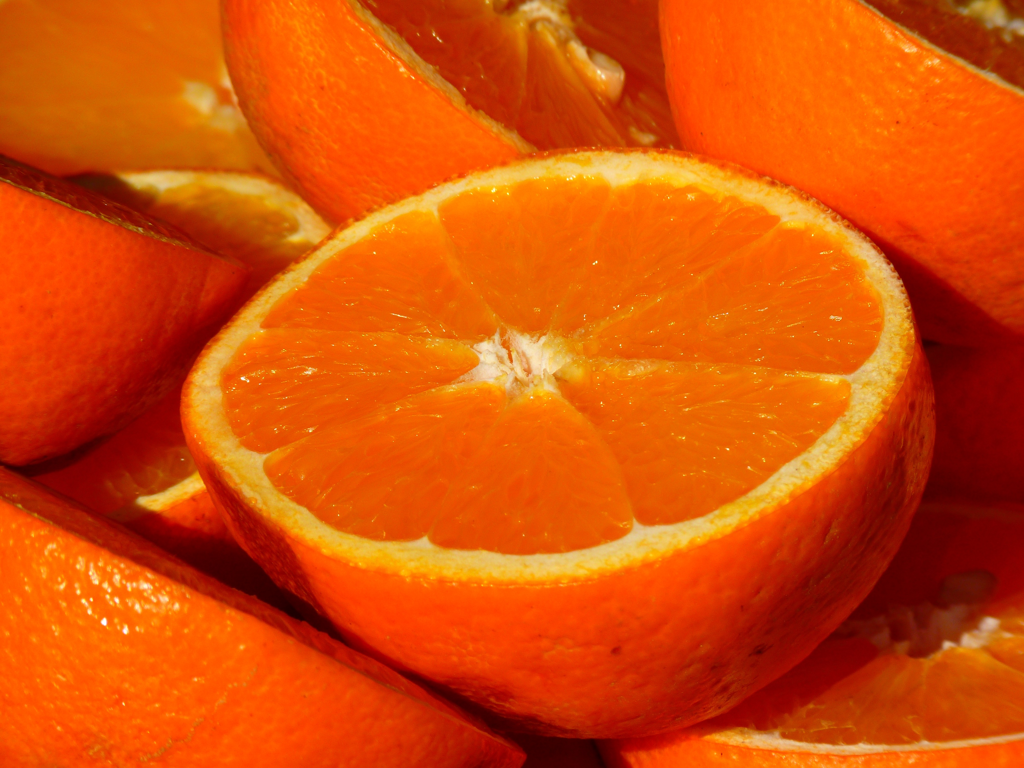 An orange orange in a slice.
