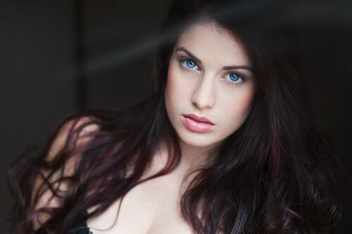 A gorgeous brunette with blue eyes.