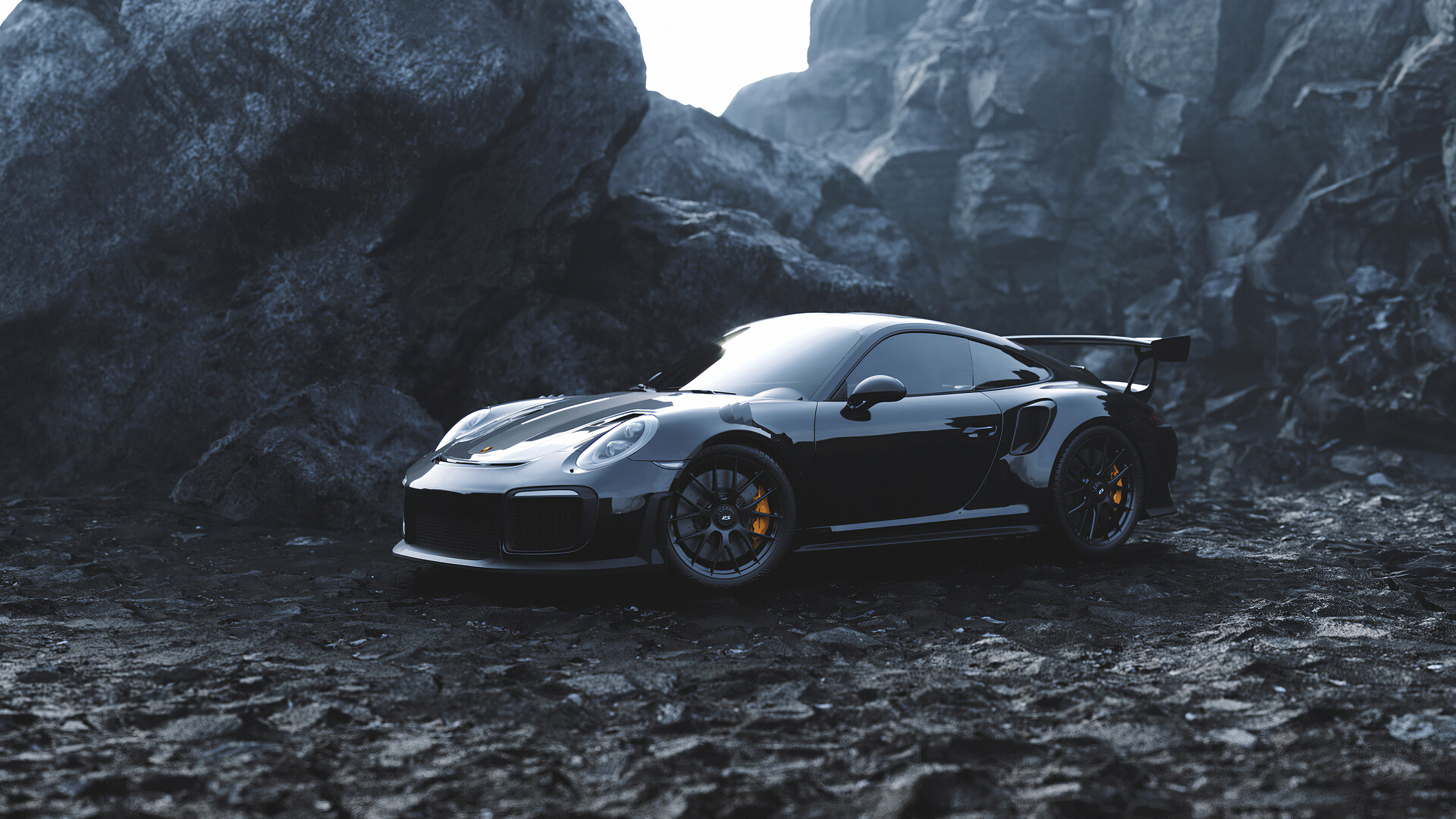 Черный Porsche на фоне скал