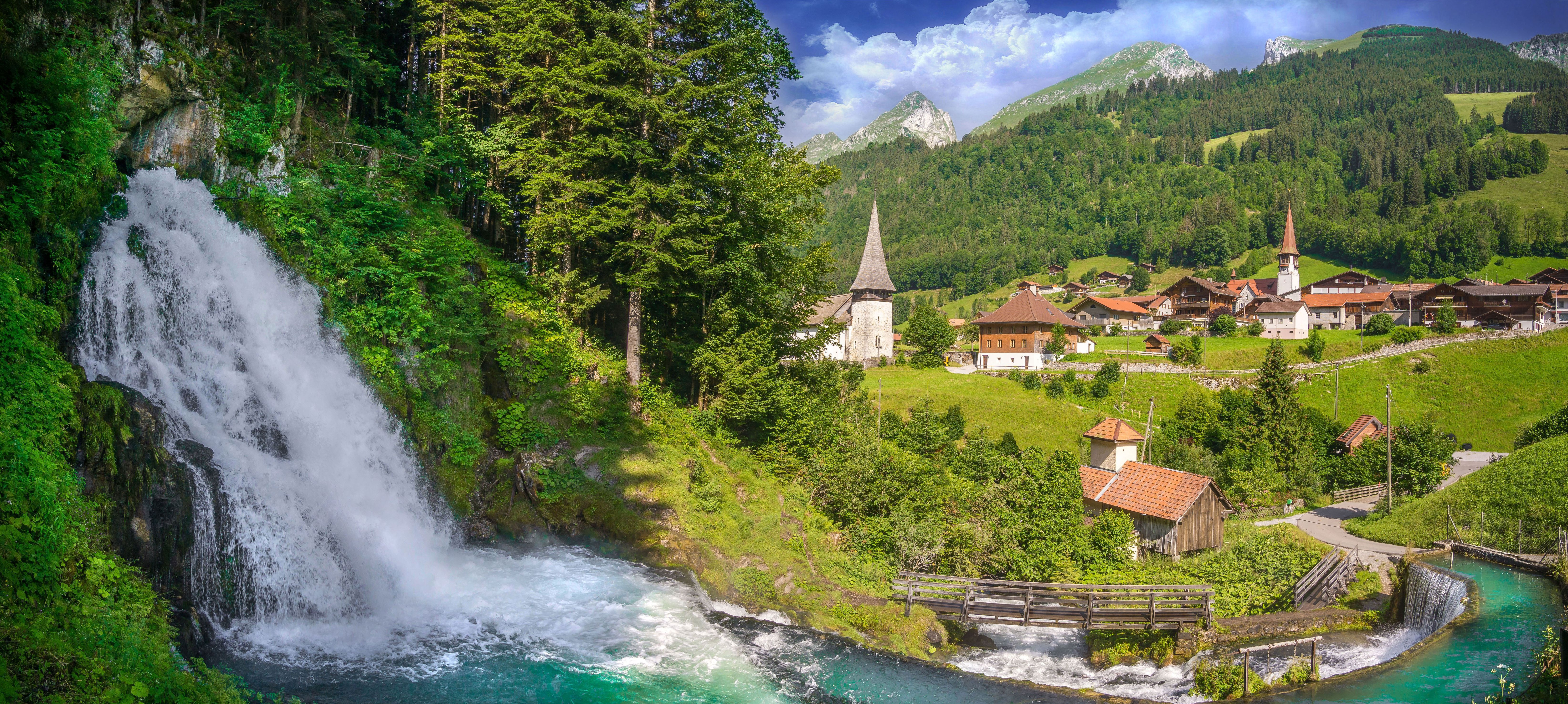 Free photo A village in Switzerland next to a waterfall