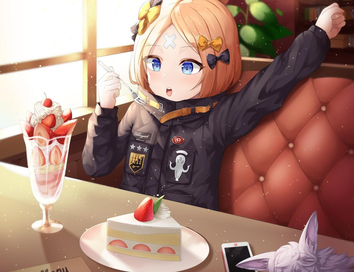 Abigail Williams sits in coffee with dessert on the table