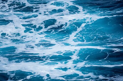 Waves with foam in the ocean