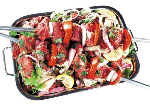 Raw kebab mixed with vegetables.