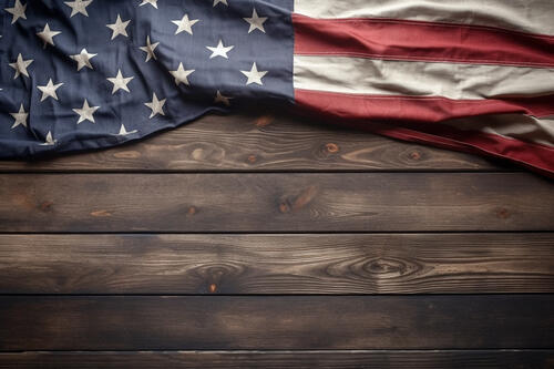 The U.S. flag is on the wooden floor