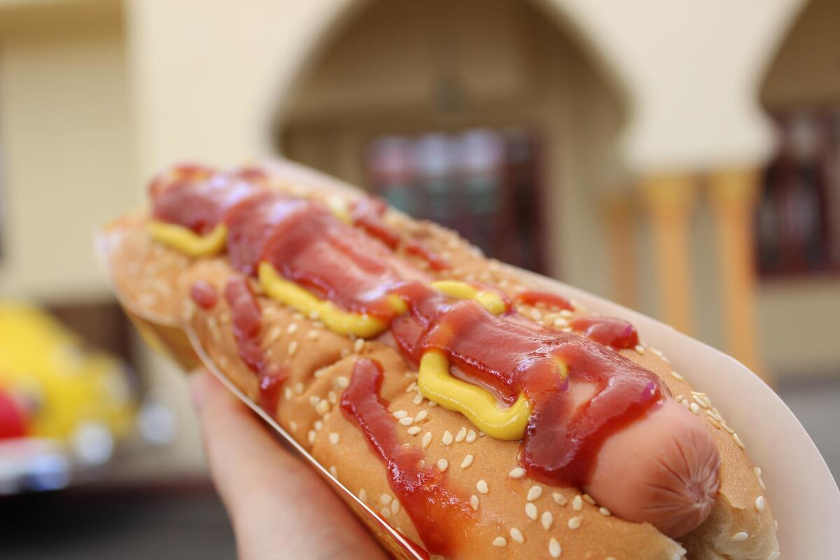 Hot dog with ketchup and ajika.