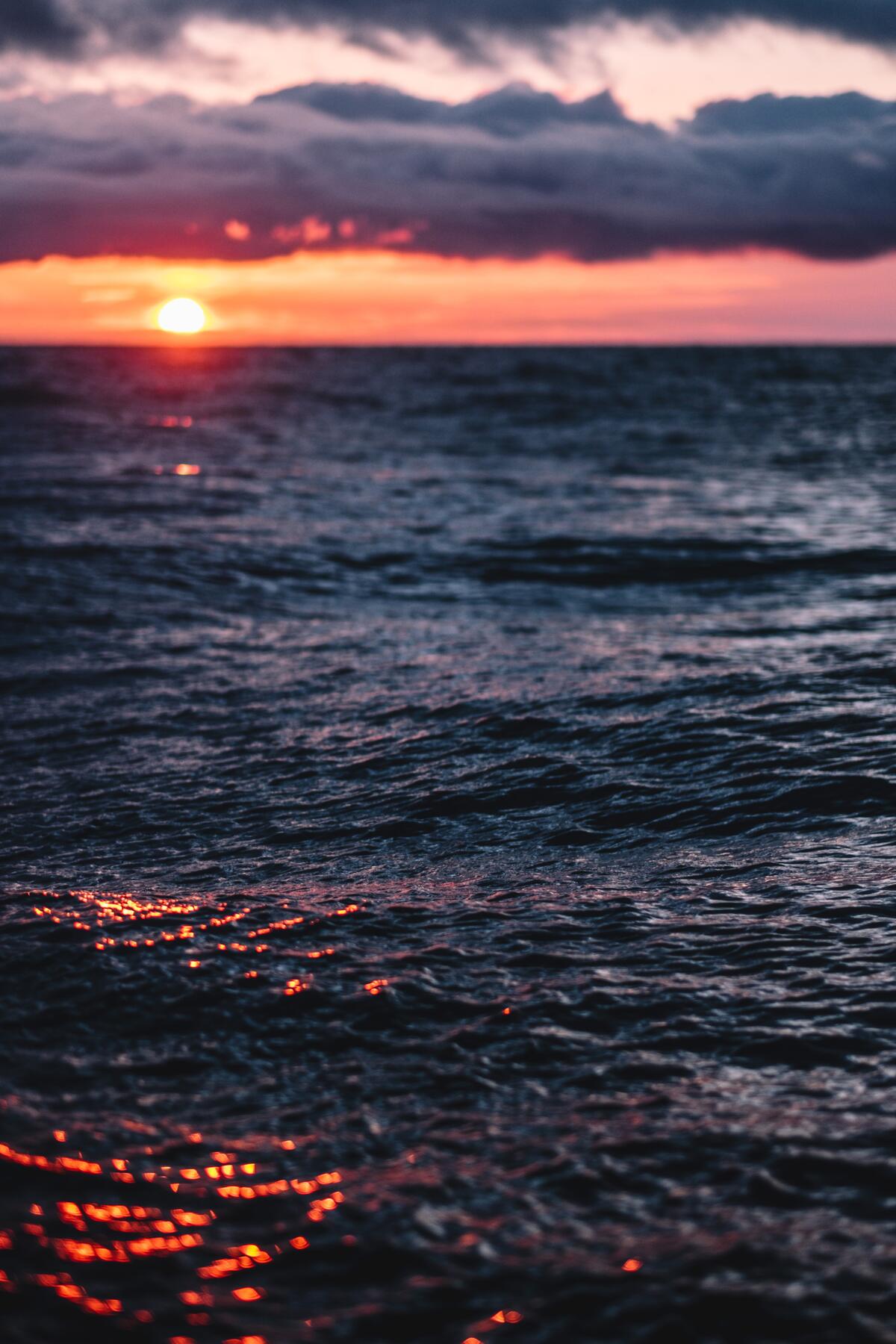 A fiery sunset on a rippling sea