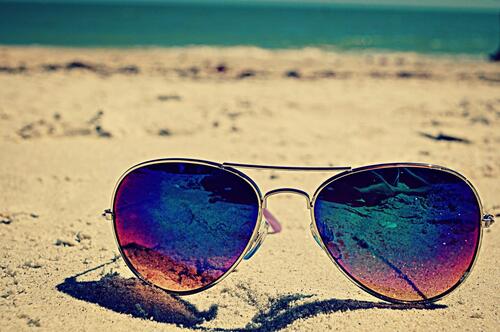 Sunglasses in the sand