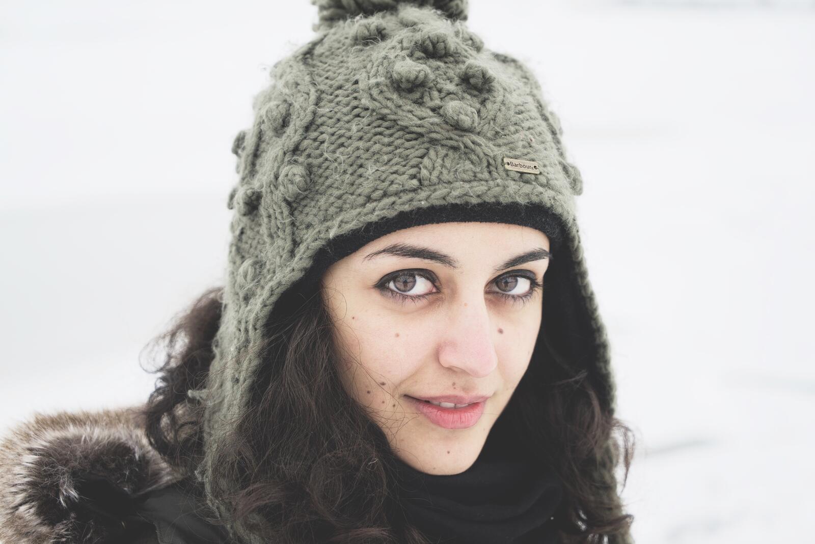 Free photo Brunette in a knit hat.