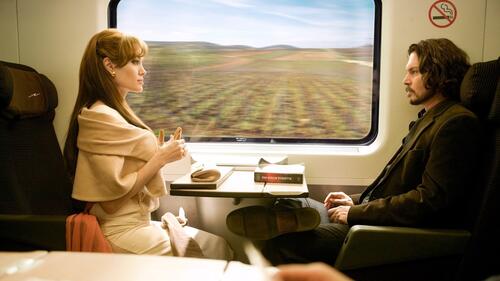 Johnny Depp and Angelina Jolie on the train at the window