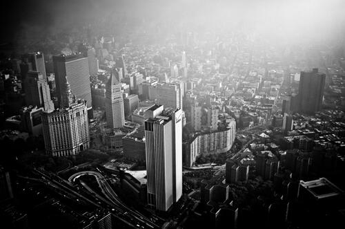 Monochrome photo of the city with high-rise buildings