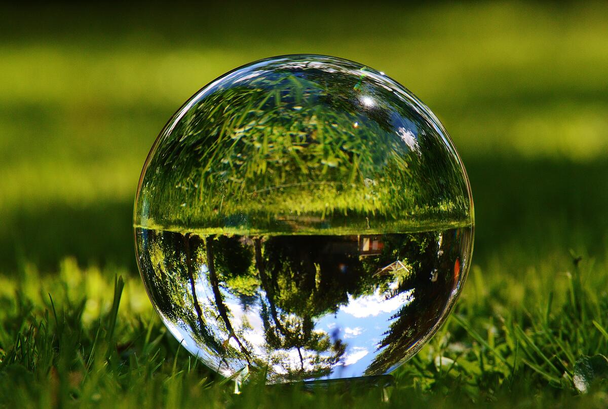 A glass ball on a green lawn