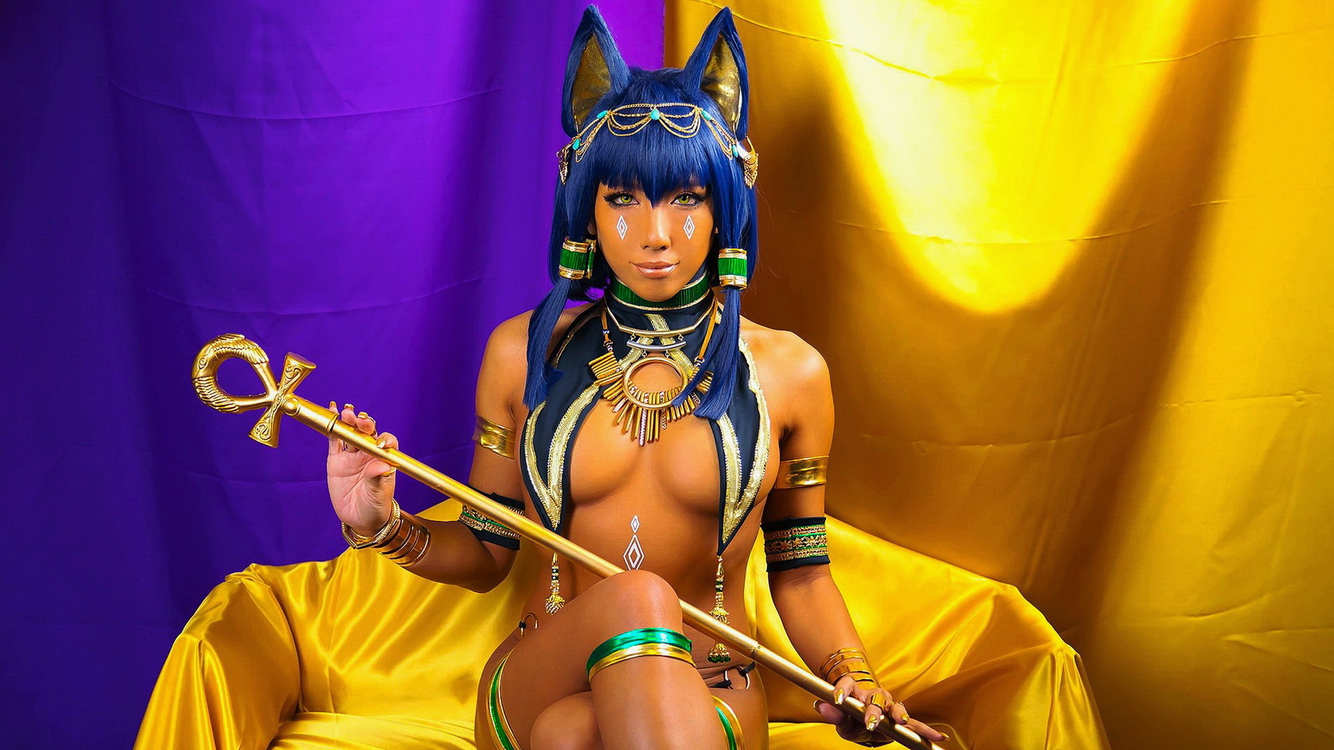 Cosplay the capricious Egyptian goddess Bastet sits on her throne
