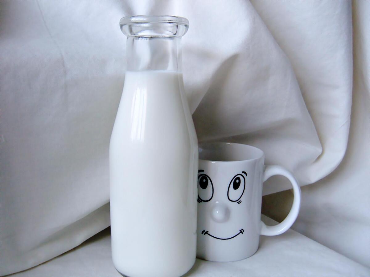 Cute white mug with a bottle of milk on it