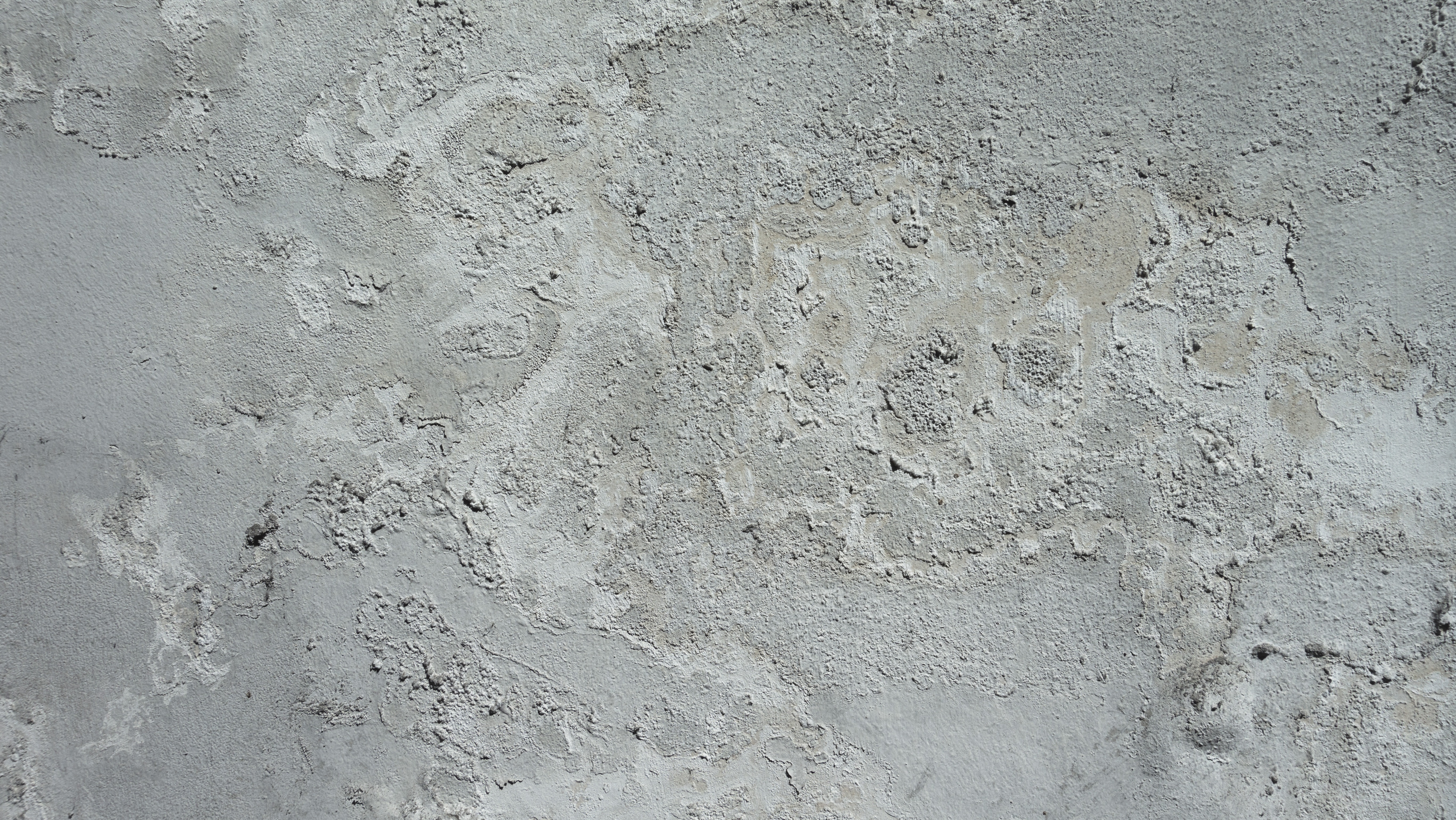 The gray background of a concrete wall