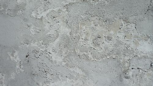 The gray background of a concrete wall
