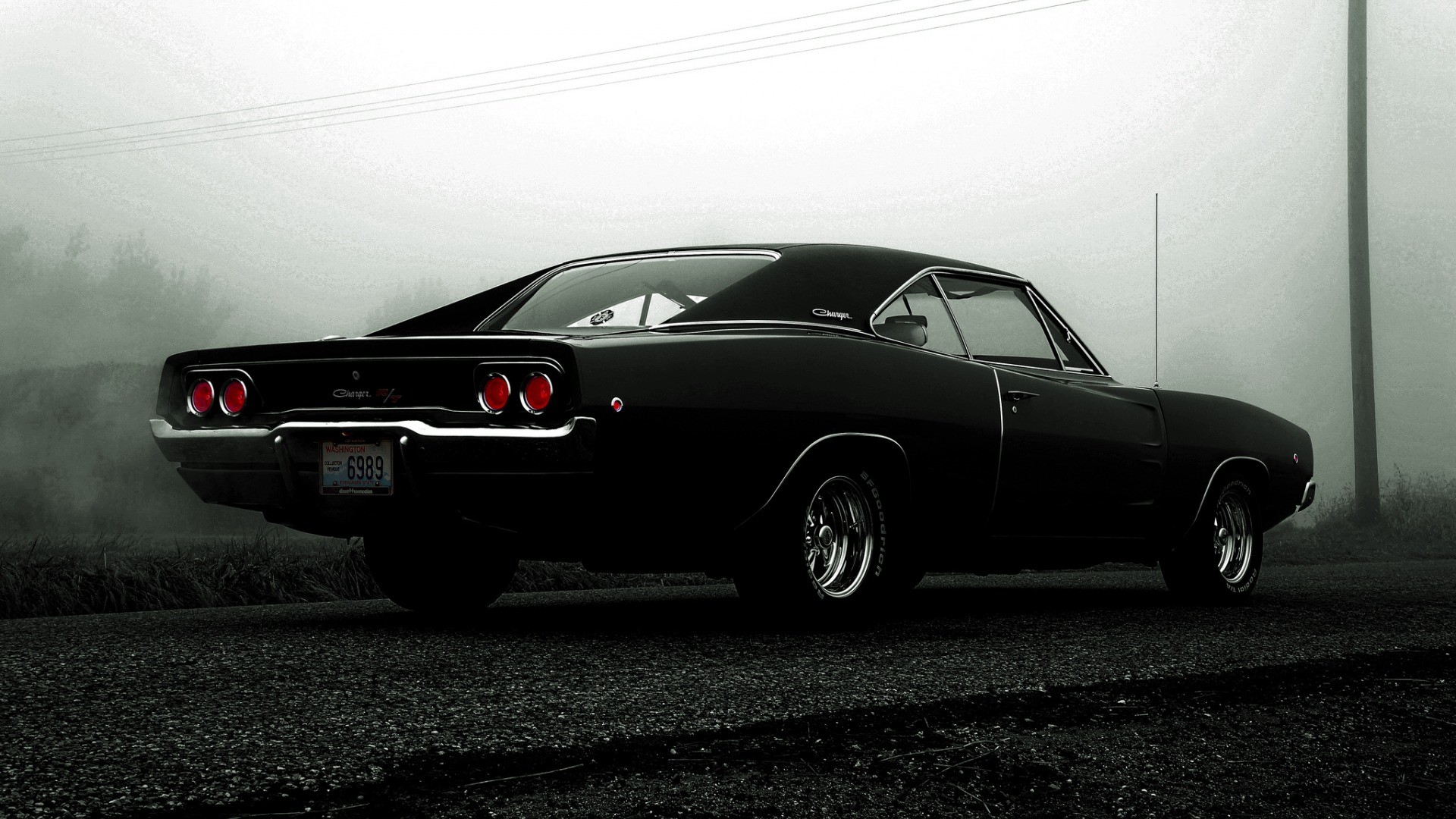 A cool 1968 Dodge Charger R T on a foggy road.