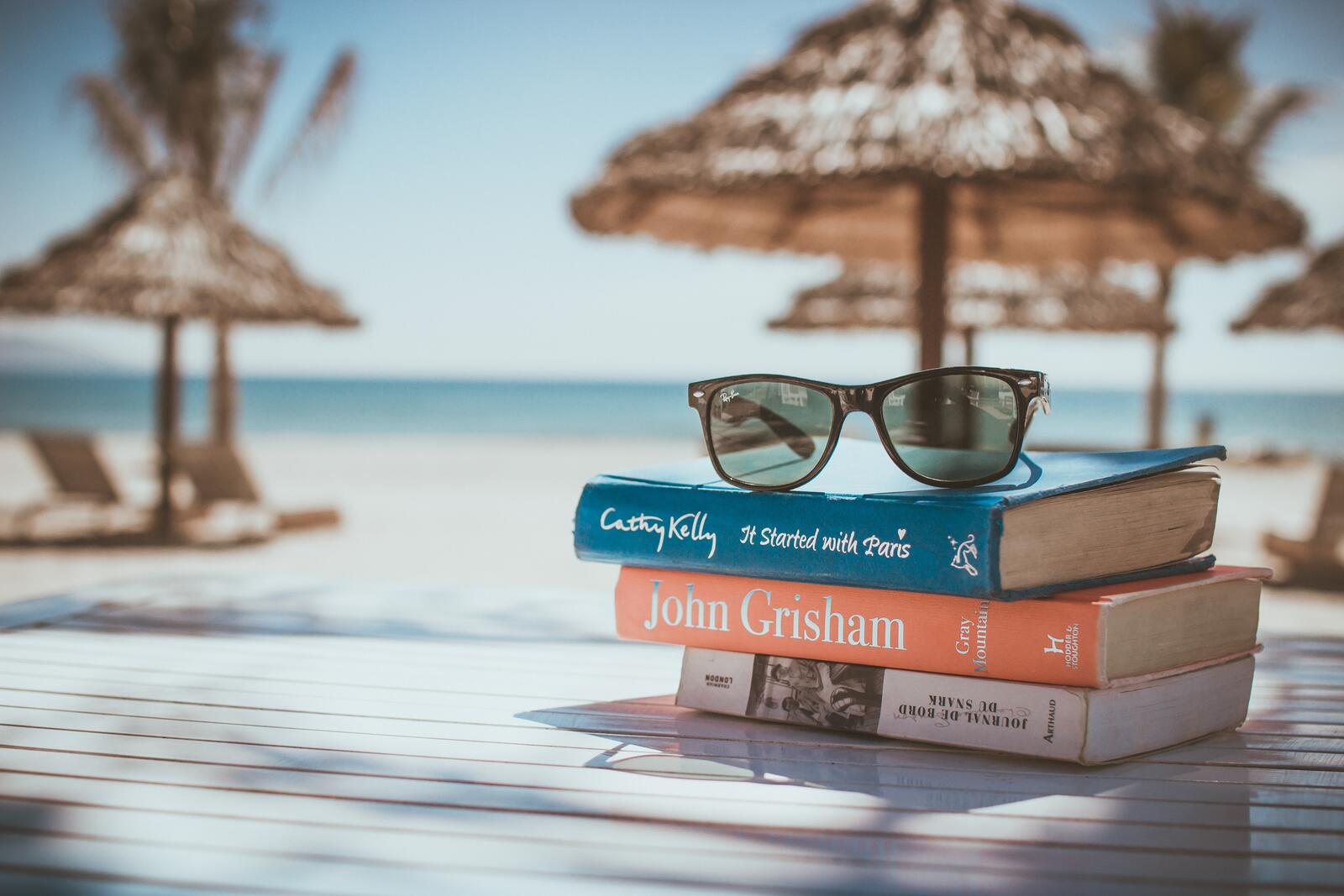 Free photo Vacationing with books on the beach