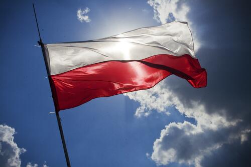 The flag of Poland against the sky