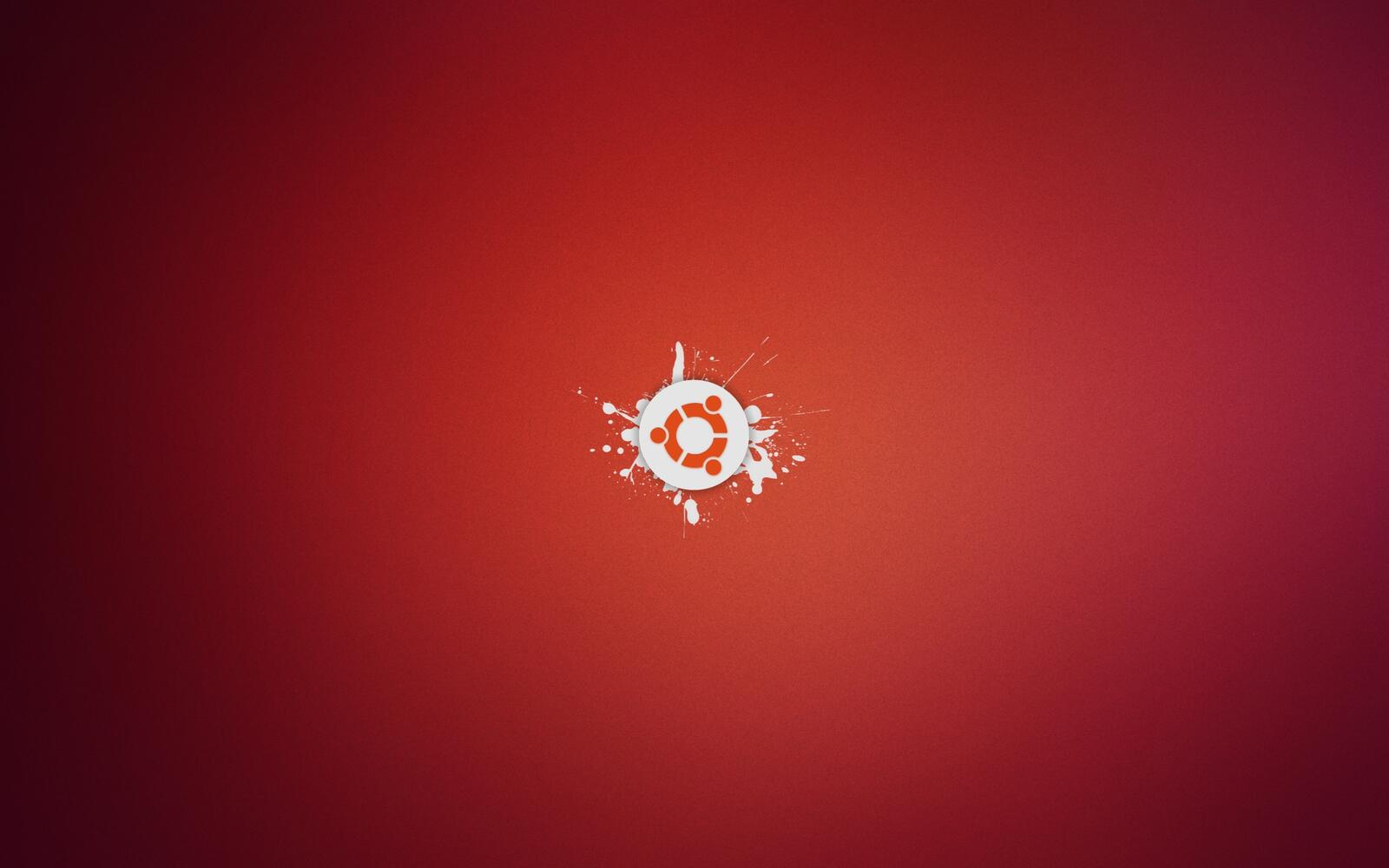 免费照片红色背景上的 Ubuntu 徽标