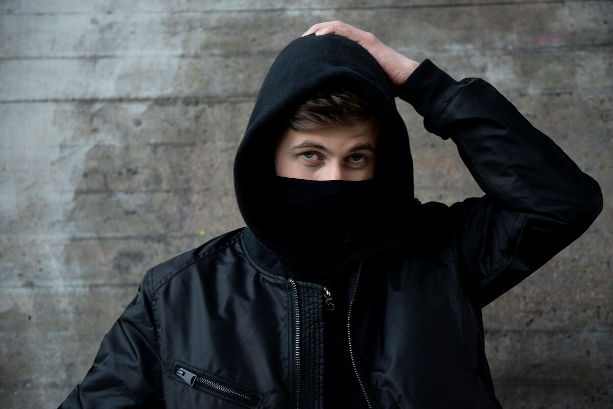 Alan Walker with his face covered