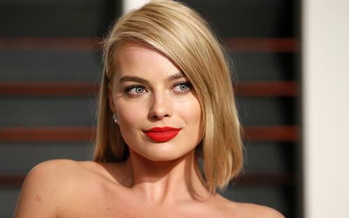 Margot Robbie with red lipstick on her lips