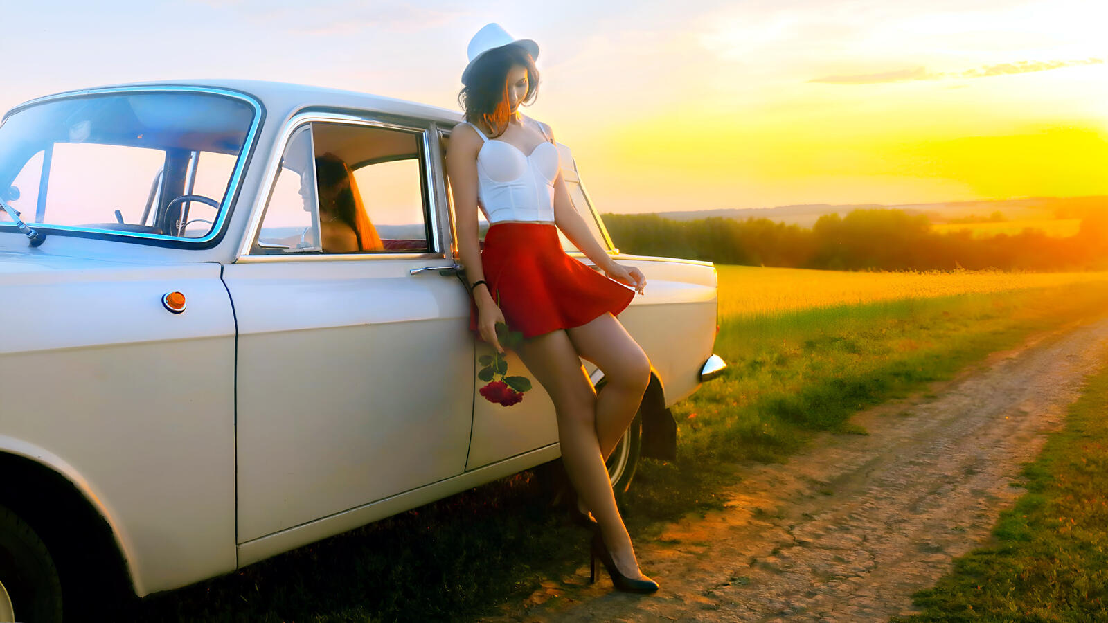 Free photo The girl in the red skirt and panama by the old white car.