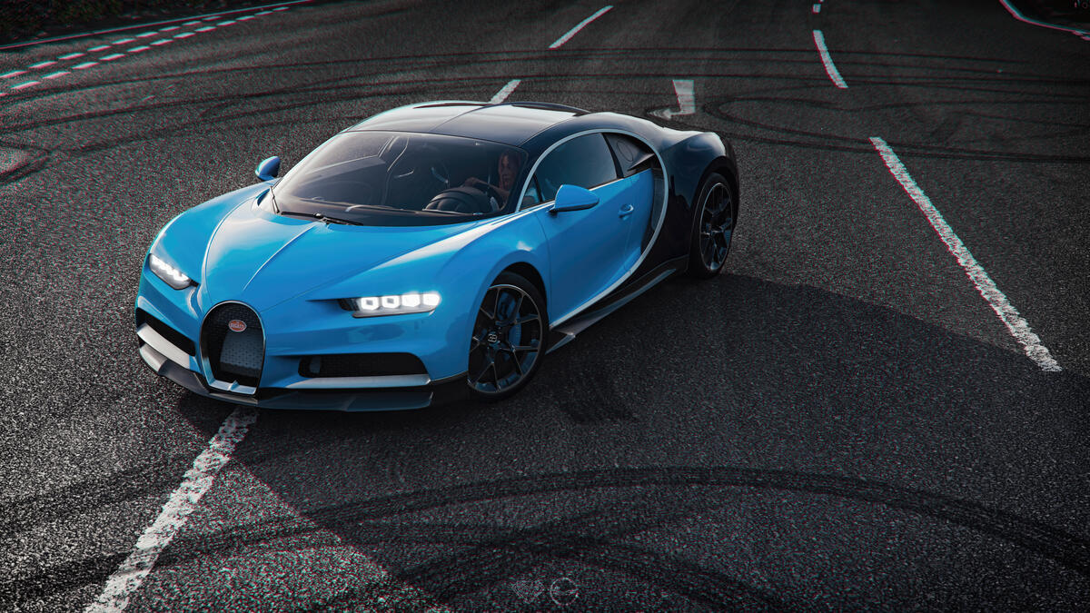 Голубой Bugatti Chiron со включенными фарами