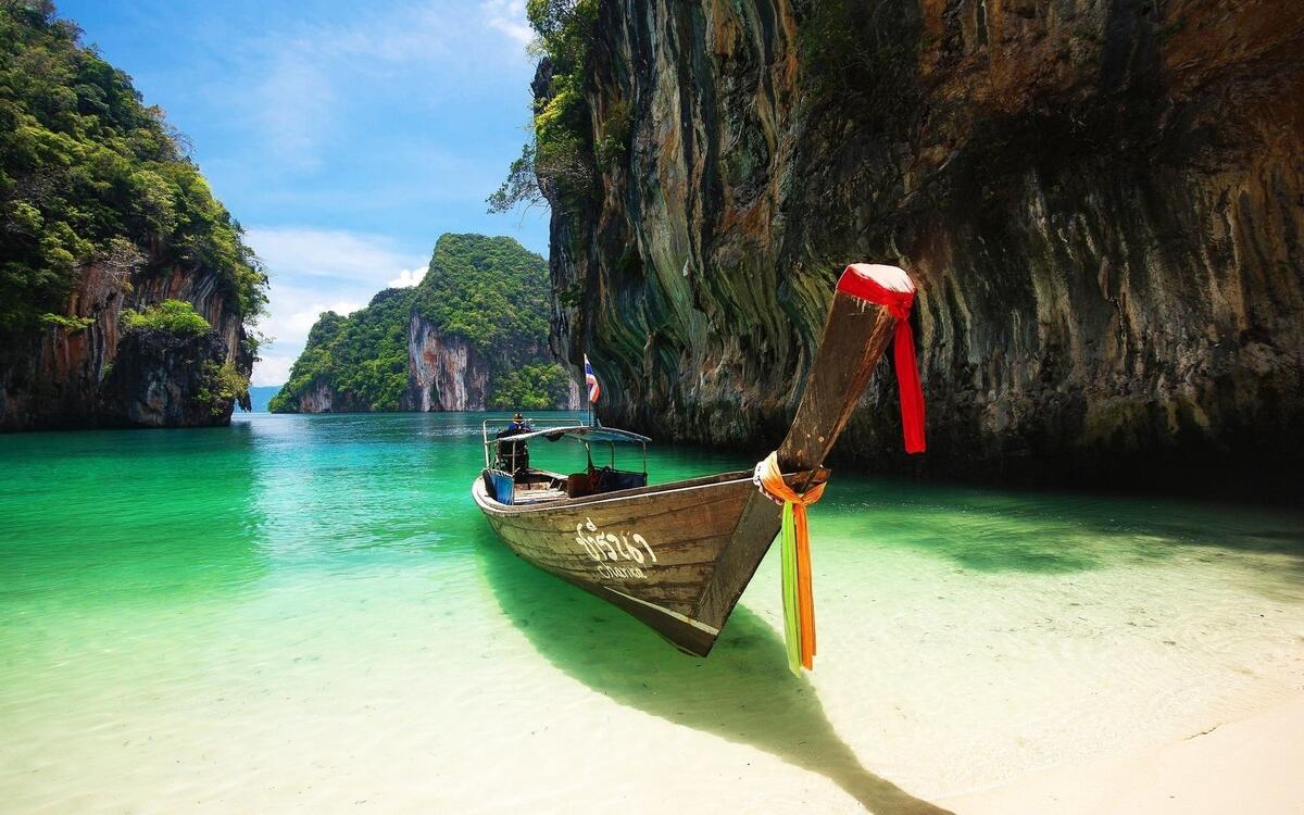 Canoeing on the sandy shore of Halong Bay