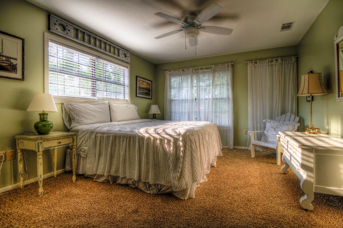 Interior of a bedroom with a large bed