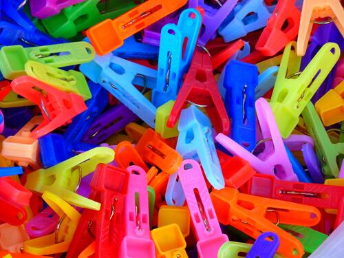 A bunch of colored clothespins