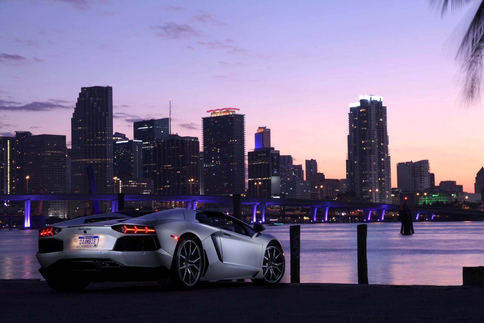 Wallpapers wallpaper lamborghini aventador view from behind cityscape on the desktop