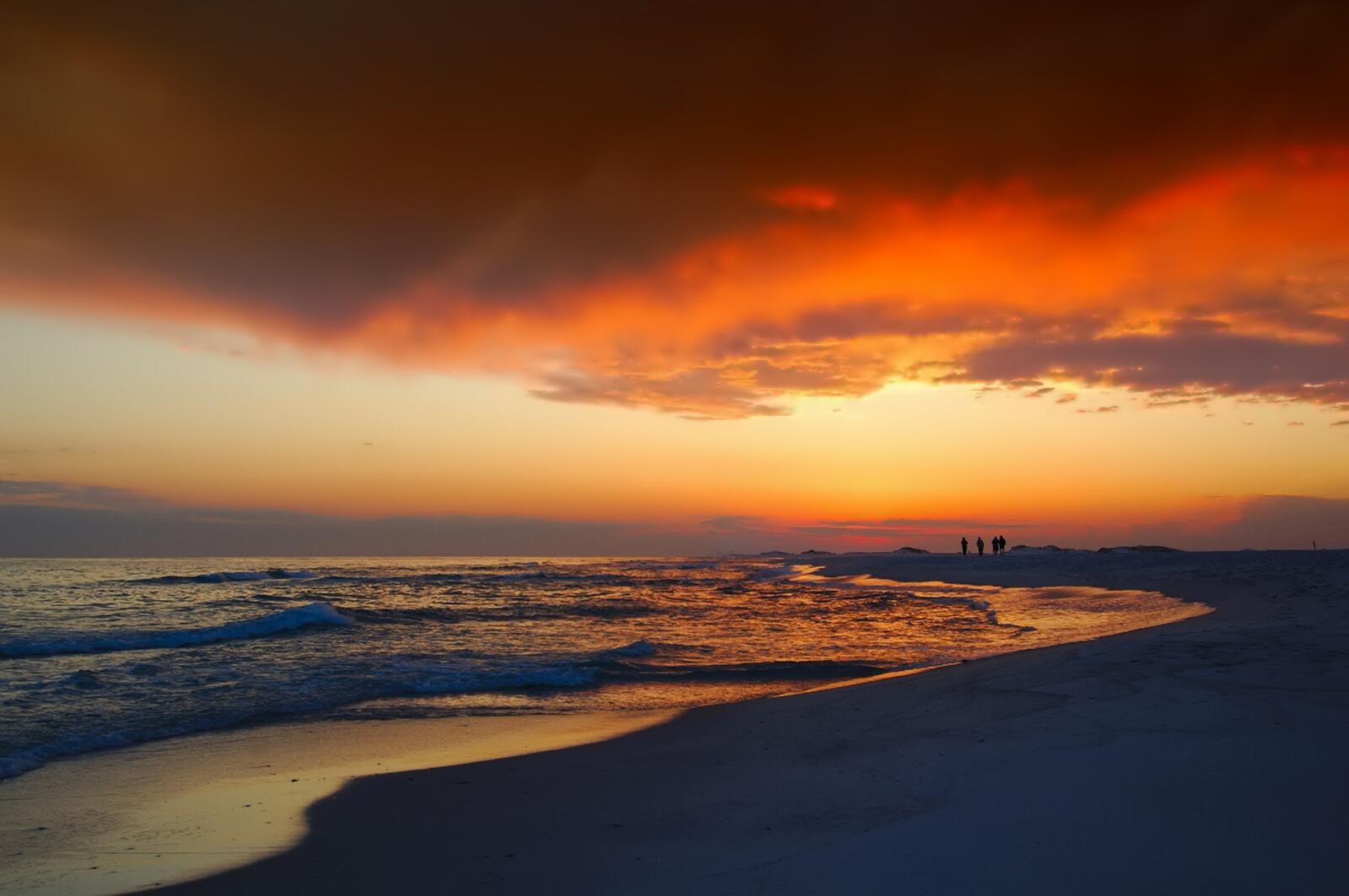 免费照片夕阳下的海滨沙滩